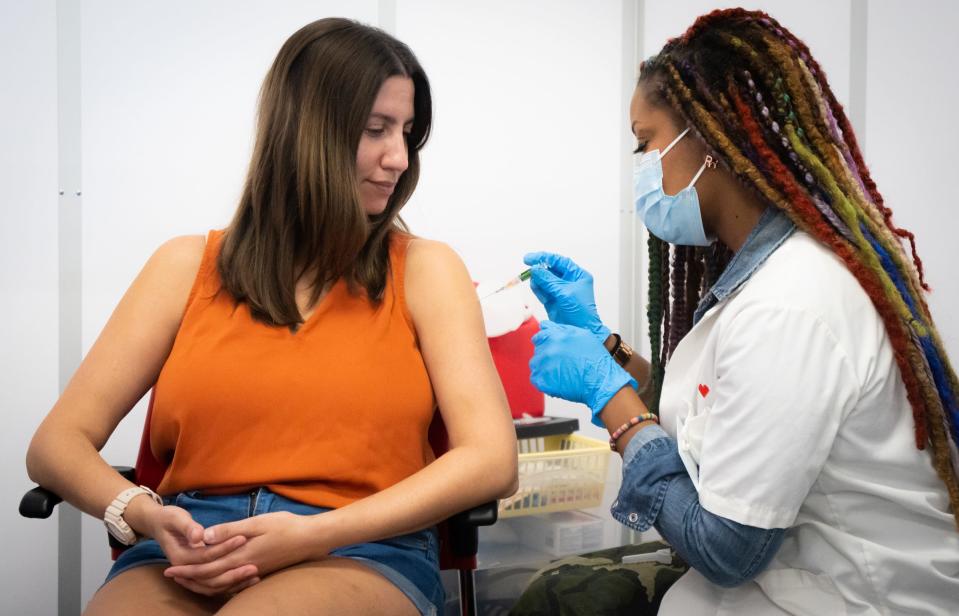 Monica Ortiz, getting her vaccination from Rochelle Guyse, said she gets a flu shot every year. Protection wanes over the months, so it's important not to skip a year.