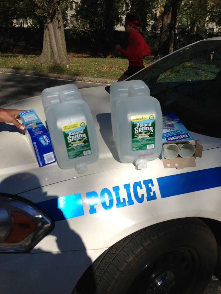 #NYPD members providing a water stop for the runners of the #unofficial #nycmarathon. Amazing to be a part of this.