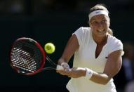 Petra Kvitova of the Czech Republic hits a shot during her match against Jelena Jankovic of Serbia at the Wimbledon Tennis Championships in London, July 4, 2015. REUTERS/Henry Browne