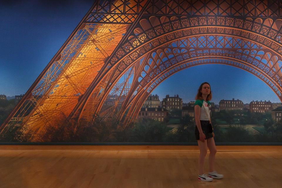 "Night view of the Eiffel Tower in Paris, France" is one of many soundstage and set paintings on display.