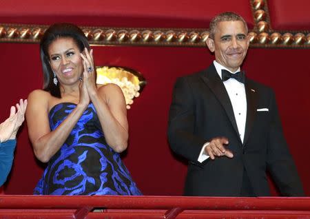 U.S. President Barack Obama and first lady Michelle Obama attend the Kennedy Center Honors at the Kennedy Center in Washington December 6, 2015. REUTERS/Yuri Gripas