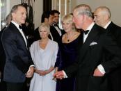 LONDON, UNITED KINGDOM - OCTOBER 23: Prince Charles, Prince of Wales (R) and Camilla, Duchess of Cornwall (2nd R) meet James Bond actors Daniel Craig (L) and Dame Judi Dench as they arrive for the Royal World Premiere of the James Bond film "Skyfall" at the Royal Albert Hall on October 23, 2012 in London, England. (Photo by Kirsty Wigglesworth - WPA Pool/Getty Images)