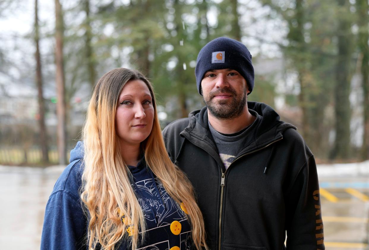 Government officials announced that it was safe for residents to return to East Palestine five days after the derailment, but stay-at-home mom Ashley McCollum, 34, stopped going back when her doctor advised against it. Her boyfriend, Matthew McAnlis, 37, returns to her home for her, despite experiencing symptoms of his own. “I grab the mail so she doesn’t have to.”  The couple is living in a hotel in a nearby town. Photo shot Wednesday, January 24, 2024.