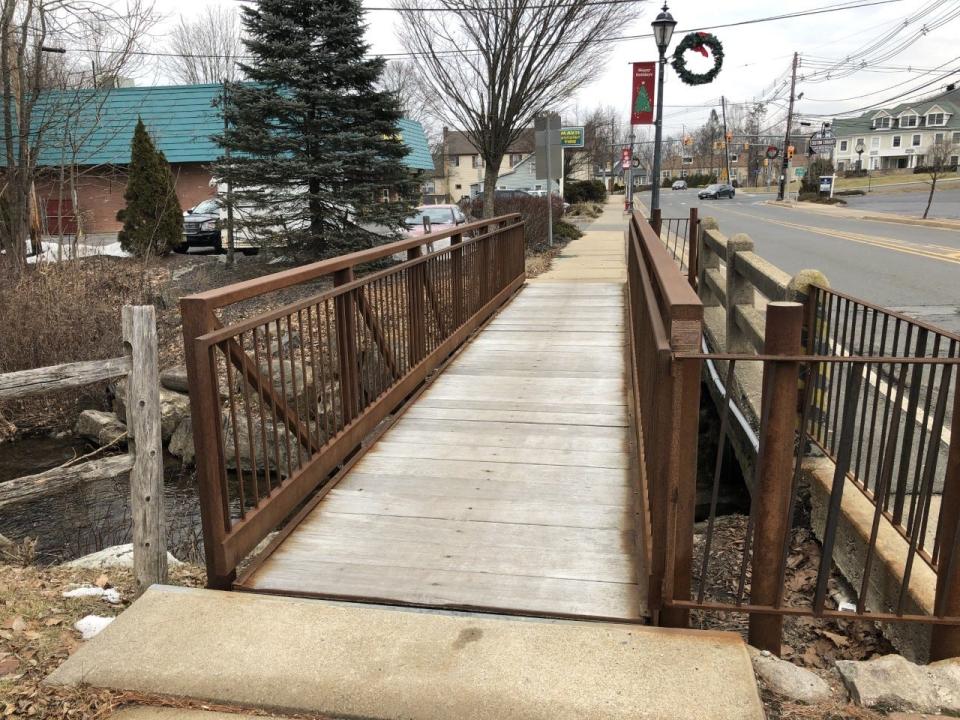 This file photo from 2021 shows the pedestrian bridge next to the Main Street bridge over the Wallkill River. This bridge and the main bridge are to be demolished this summer with a new bridge to be in place by year's end. The work involved moving the Town of Newton water main to make way for the new structure.