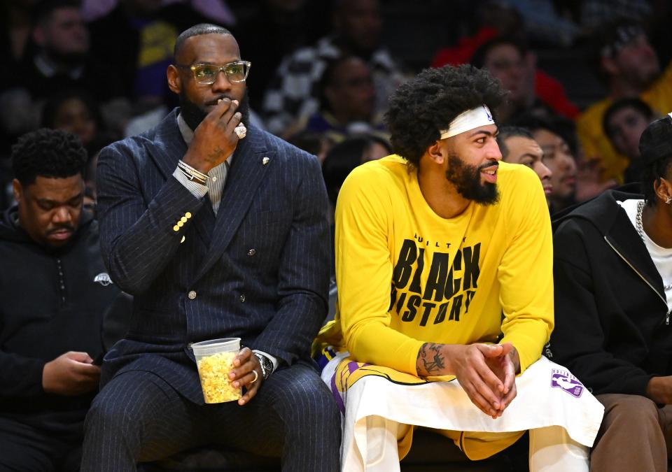LeBron James and Anthony Davis on the bench during Thursday's game against the Bucks.