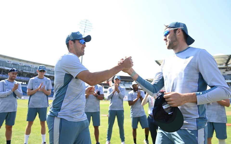 Jamie Overton is presented with his test cap by his brother Craig Overton of England ahead of day one of the 3rd test  - Gareth Copley/ECB via Getty Images