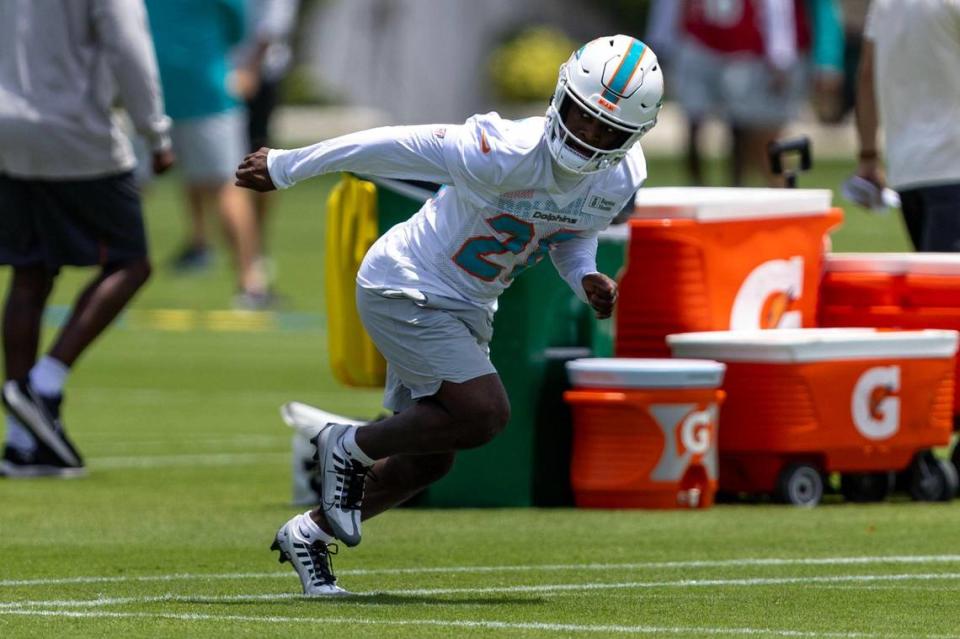 Rookie running back Devon Achane (28) warms up as he sprints during 2023 Miami Dolphins Rookie Minicamp practice at Baptist Health Training Complex in Miami Gardens, Florida, on Friday, May 12, 2023.