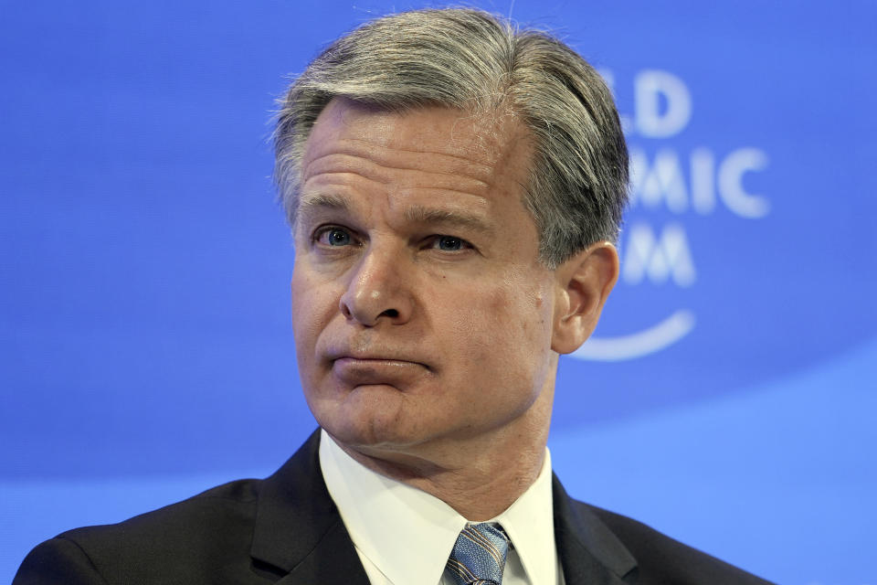 FBI Director Christopher Wray listens at the World Economic Forum in Davos, Switzerland Thursday, Jan. 19, 2023. The annual meeting of the World Economic Forum is taking place in Davos from Jan. 16 until Jan. 20, 2023. (AP Photo/Markus Schreiber)