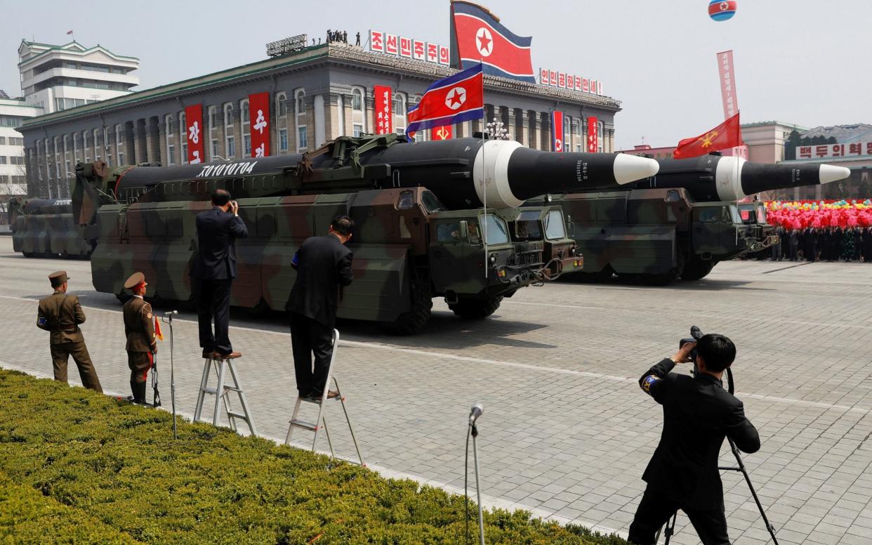 Missiles are driven past the stand during a military parade, 2017  - REUTERS