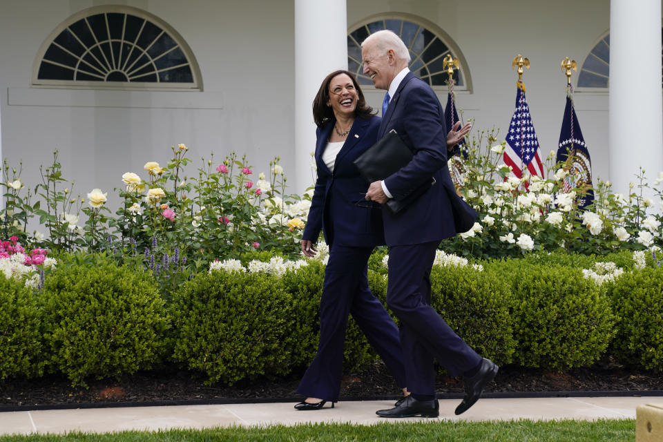 FILE - In this May 13, 2021, file photo President Joe Biden walks with Vice President Kamala Harris after speaking on updated guidance on face mask mandates and COVID-19 response, in the Rose Garden of the White House in Washington. Thanks to growing availability of the coronavirus vaccine and a recent relaxation of federal guidance on masks and distancing, the Biden administration is embracing the look and feel of pre-pandemic days on Pennsylvania Avenue. (AP Photo/Evan Vucci, File)