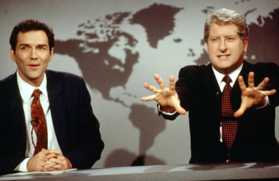 Norm Macdonald (left) and Darrell Hammond (as President Bill Clinton) on a “Weekend Update” segment in the mid-1990s. ©NBC/Courtesy Everett Collectio