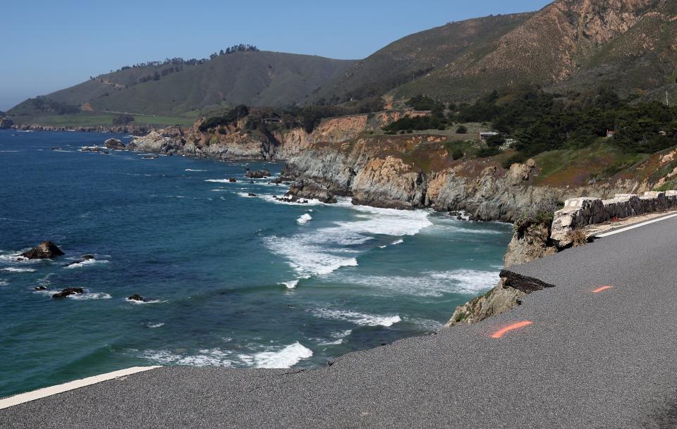 A hole is visible where a section of southbound Highway 1 broke off and fell in the ocean at Rocky Creek Bridge on April 02, 2024 near Big Sur, California. A section of California's famed Highway 1 collapsed into the ocean following heavy rains.