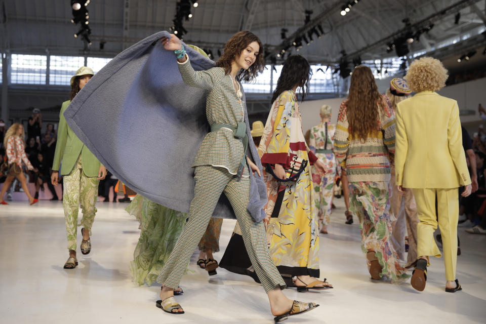 Models wear creations as part of the Etro women's 2019 Spring-Summer collection, unveiled during the Fashion Week in Milan, Italy, Friday, Sept. 21, 2018. (AP Photo/Luca Bruno)