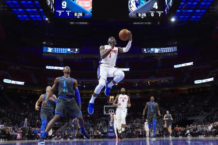 Jan 31, 2019; Detroit, MI, USA; Detroit Pistons guard Reggie Jackson (1) goes to the basket on Dallas Mavericks forward Harrison Barnes (40) in the first half at Little Caesars Arena. Mandatory Credit: Rick Osentoski-USA TODAY Sports