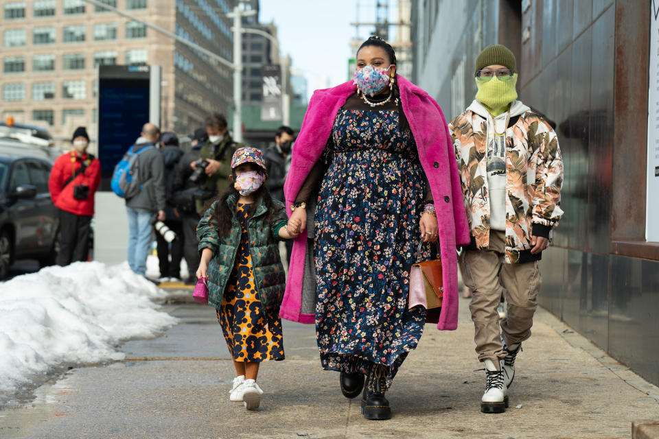 Fashion Week attendees D'Artagnan Lou, Greivy Lou and Alvieri Lou outside Spring Studios on Feb. 16, 2021.