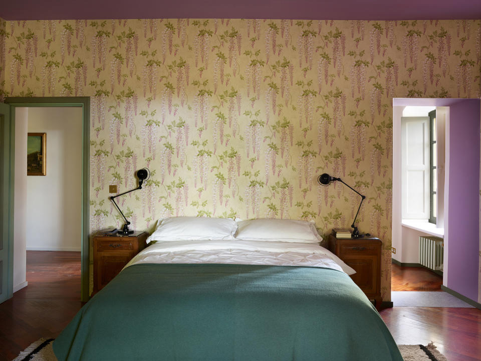 bedroom wallpapered with wisteria