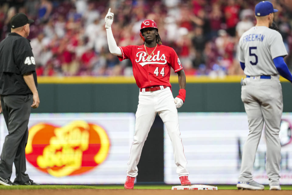 Cincinnati Reds' Elly De La Cruz gestures to the dugout after hitting a double against the Los Angeles Dodgers during the third inning of a baseball game in Cincinnati, Tuesday, June 6, 2023. (AP Photo/Aaron Doster)
