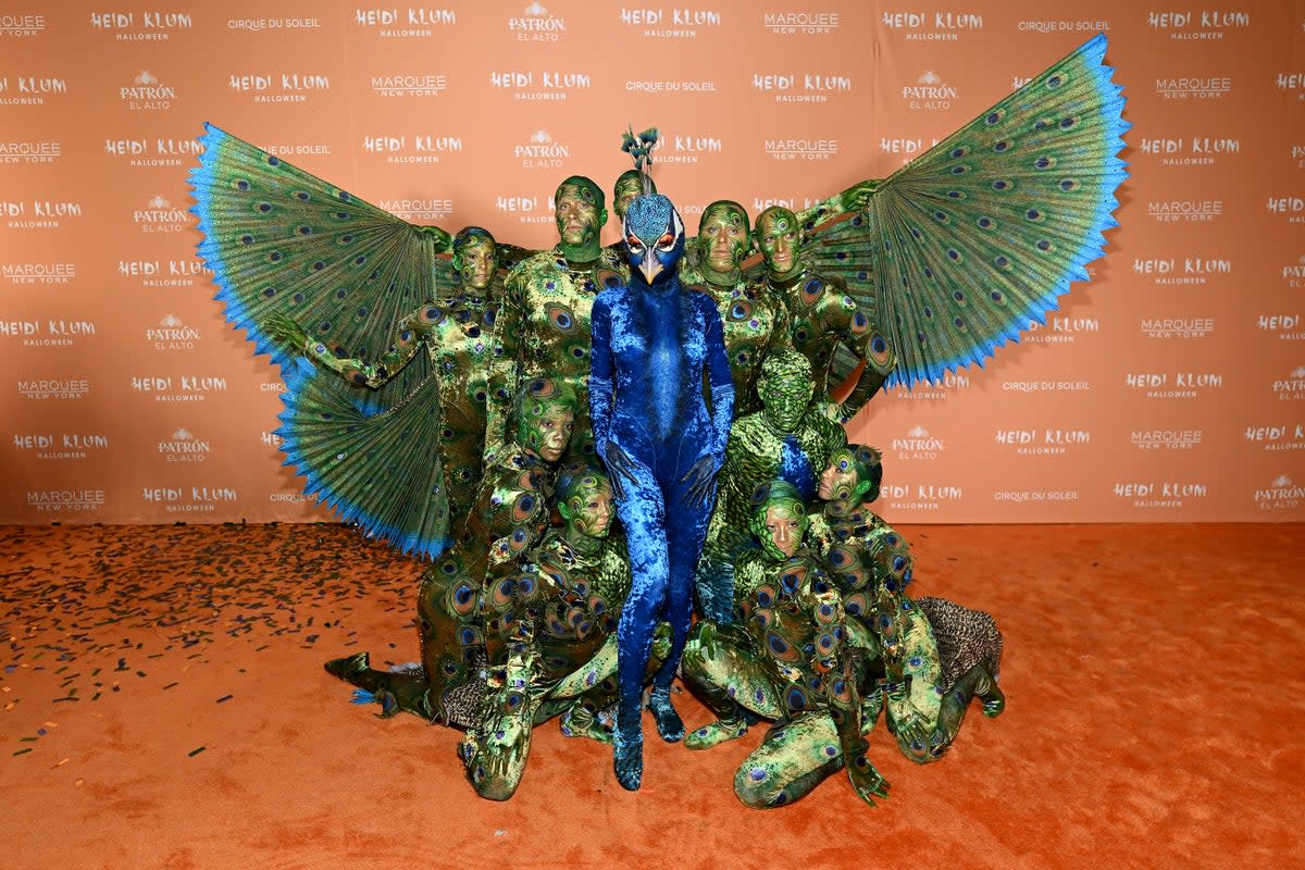 Heidi Klum wowed onlookers as she arrived at her annual Halloween party in New York dressed as a peacock (Getty Images for Heidi Klum)