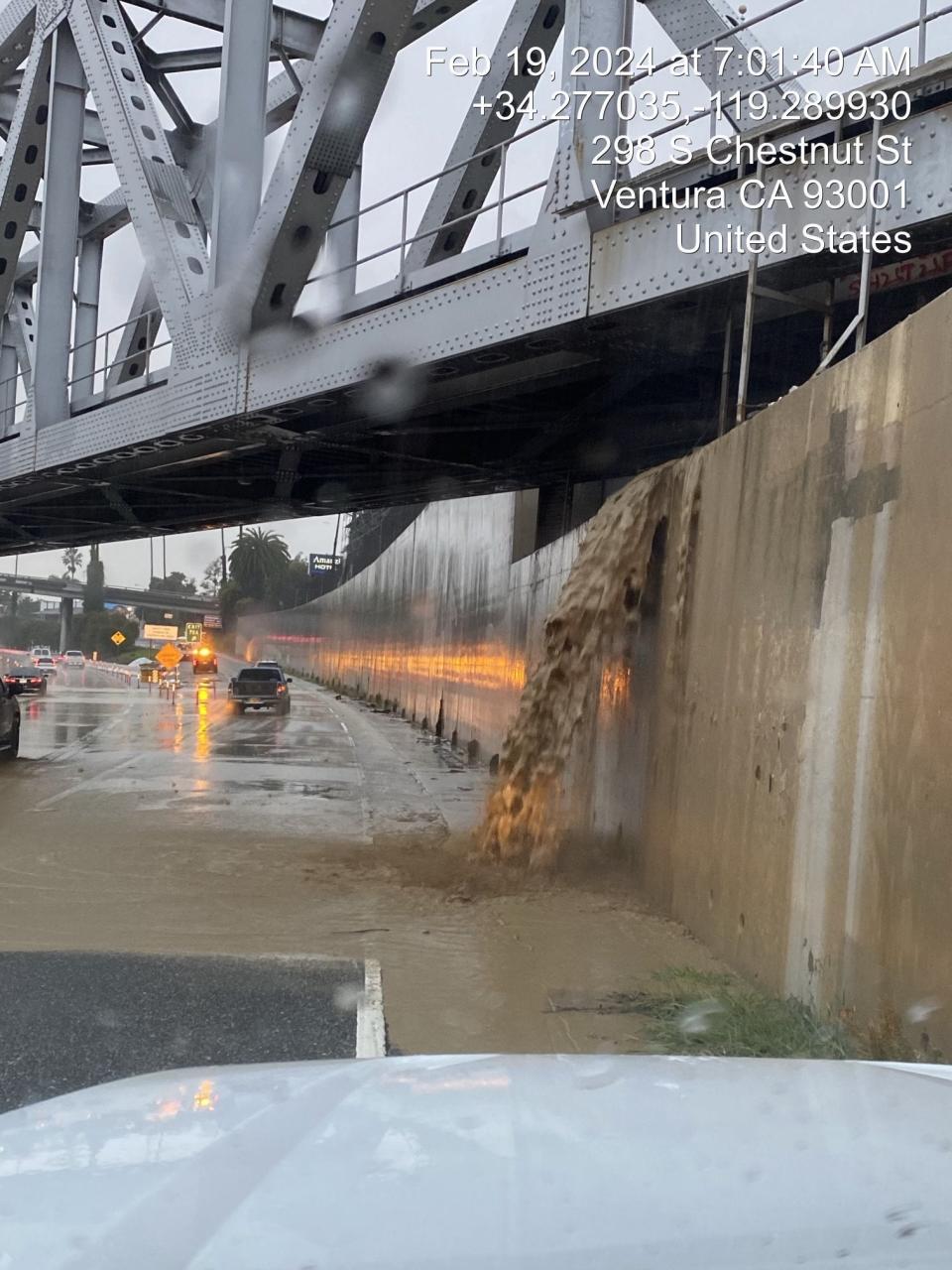 Rushing floodwaters pour onto US-101 in Ventura, California (California Department of Transportation)