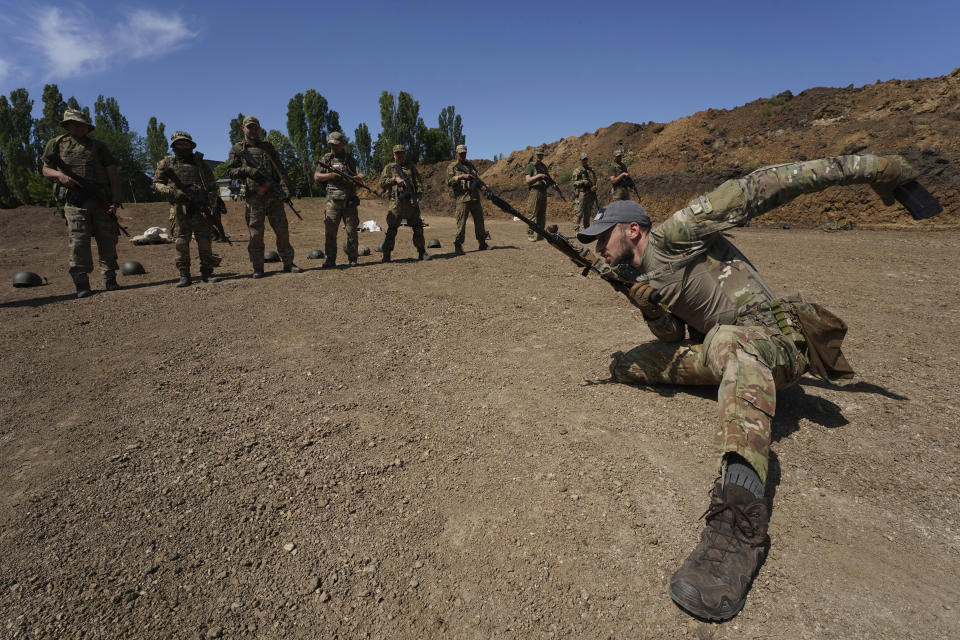 Servicemen of the newly created National Guard unit train in the Kharkiv region, Ukraine, Thursday, June 1, 2023. (AP Photo/Andrii Marienko)