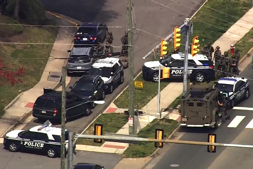 Police surround a vehicle where a woman remains barricaded in her vehicle for more than 24 hours in Northern Va., on March 29, 2023. (NBC Washington)