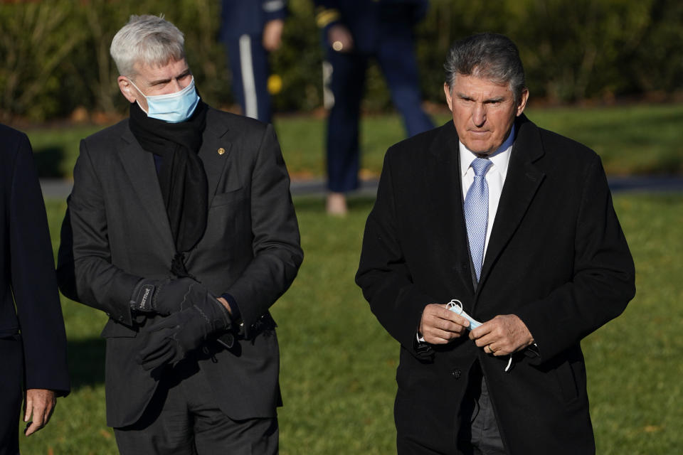 Sen. Bill Cassidy, R-La., and Sen. Joe Manchin, D-W.Va., arrive before President Joe Biden signs the $1.2 trillion bipartisan infrastructure bill into law during a ceremony on the South Lawn of the White House in Washington, Monday, Nov. 15, 2021. (AP Photo/Susan Walsh)