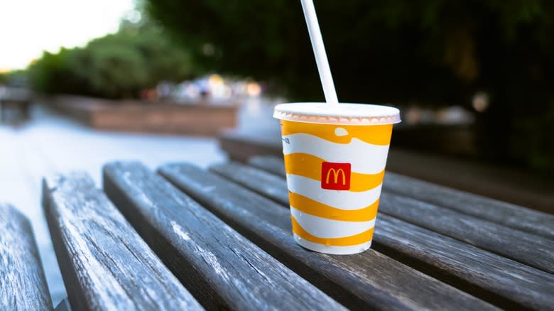 Mcdonald's cup on bench