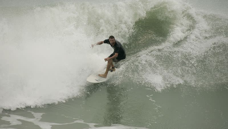 One of many surfers at Juno Beach, Fla., on May 9, 2007, take advantage of the unusually high waves coming ashore.