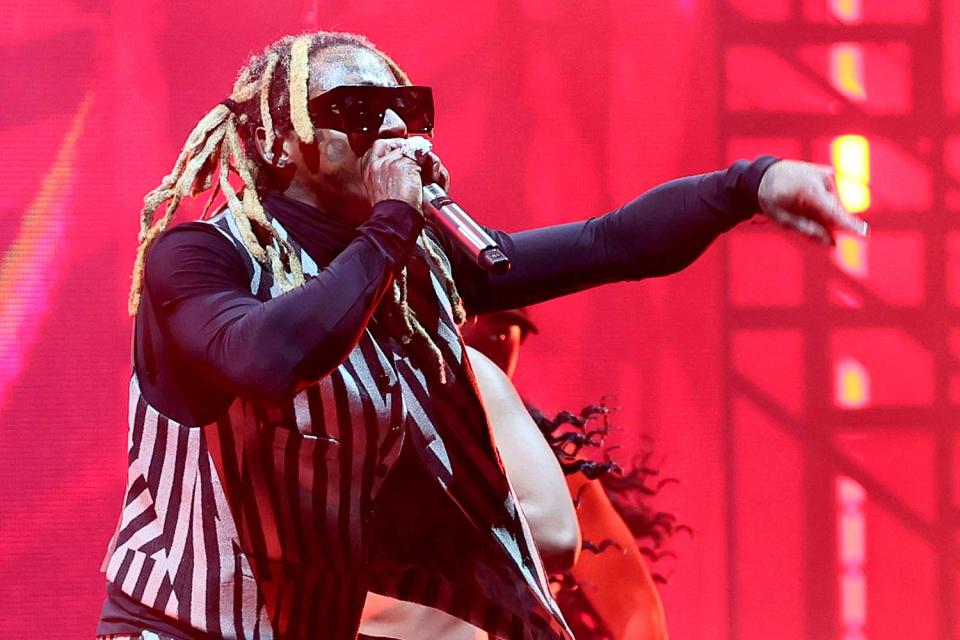 <p>Theo Wargo/Getty</p> Lil Wayne Performs at the MTV VMAs 2023