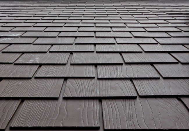 Close up of chocolate brown composite shingles
