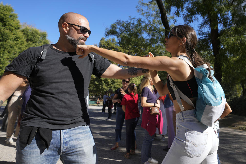 Women attend a personal self-defense course, in a public park Milan, Italy, Saturday, Sept. 17, 2022. Italy could be on the verge of electing its first woman premier. That prospect delights some Italian women, but others are dismayed by her conservative beliefs and policies. If opinion polls prove on the mark, Giorgia Meloni and the far-right Brothers of Italy party she co-founded less than a decade ago will triumph in Sept. 25 elections for Parliament. (AP Photo/Luca Bruno)