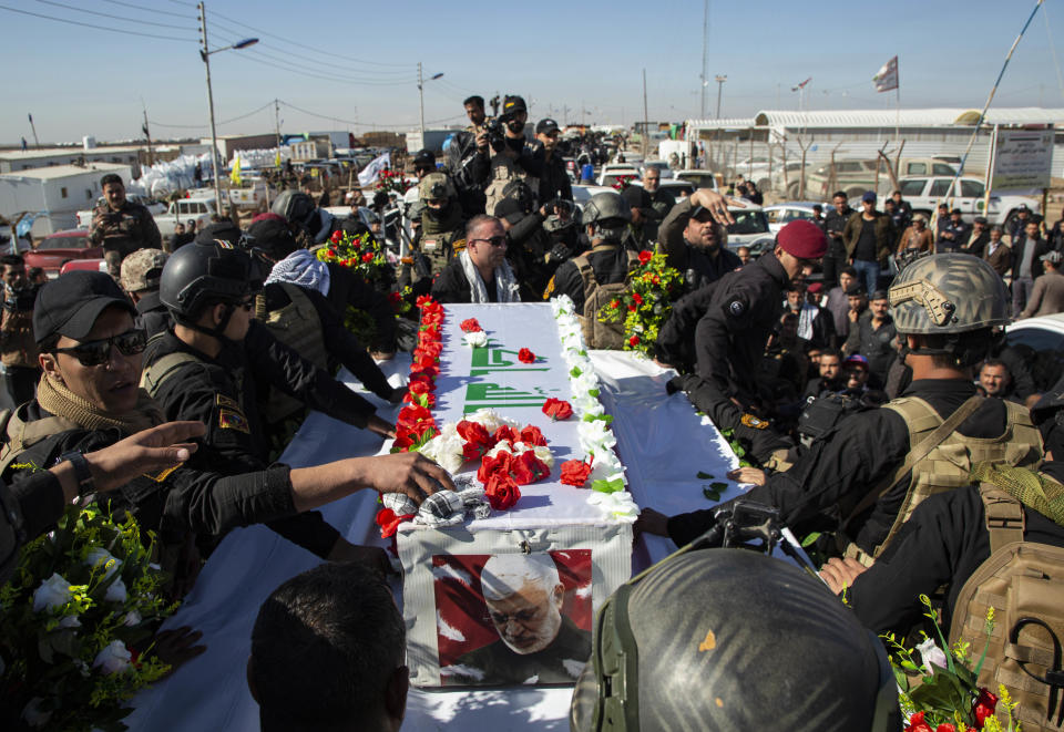 The body Abu Mahdi al-Muhandis, the slain chief of Hashed al-Shaabi, an Iraqi paramilitary force with close ties to Iran, is welcomed in the southern city of Basra after it came from Iran on January 7, 2020 ahead on his burial. - Muhandis, killed early on January 3 in a US strike on Baghdad, was seen as Tehran's man in Iraq and a sworn enemy of the United States. The US strike on Baghdad's international airport early Friday also killed his personal friend Qasem Soleimani, a top commander in Iran's Revolutionary Guard Corps. (Photo by Hussein FALEH / AFP) / The erroneous mention[s] appearing in the metadata of this photo by Hussein FALEH has been modified in AFP systems in the following manner: [2020] instead of [2019]. Please immediately remove the erroneous mention from all your online services and delete it  from your servers. If you have been authorized by AFP to distribute it to third parties, please ensure that the same actions are carried out by them. Failure to promptly comply with these instructions will entail liability on your part for any continued or post notification usage. Therefore we thank you very much for all your attention and prompt action. We are sorry for the inconvenience this notification may cause and remain at your disposal for any further information you may require. (Photo by HUSSEIN FALEH/AFP via Getty Images)