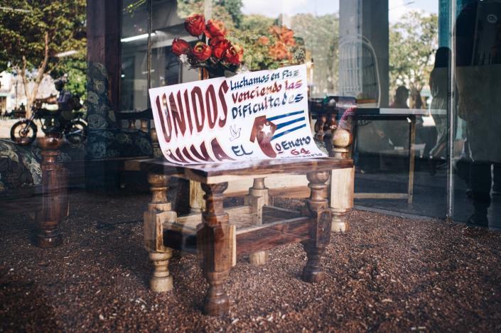 A shop display commemorating the Cuban revolution’s 64th anniversary reads: ‘United we fight in peace, overcoming all difficulties.’ (James Clifford Kent/The Conversation)