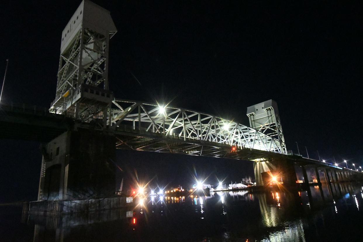 Traffic travels across the Cape Fear Memorial Bridge Jan. 11 while crews work on the bridge overnight to build temporary decks to help with the larger repair project, which requires traffic crossing the span to be closed in one direction for several weeks at a time.