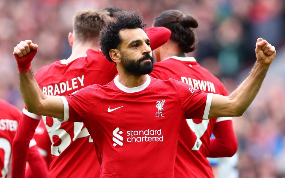 Mohamed Salah of Liverpool celebrates scoring his side's second goal during the Premier League match between Liverpool FC and Brighton & Hove Albion at Anfield on March 31, 2024 in Liverpool, England