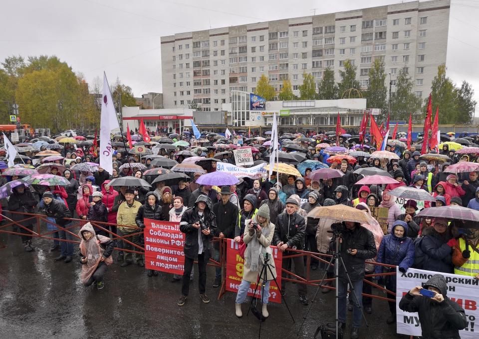 People gather during a rally against plans for the waste plant in a pristine Russian forest has gained national prominence, in Arkhangelsk, Russia, Sunday, Sept. 22, 2019. Several thousand people have taken to the streets across northwest Russia to protest a controversial plan to build a major waste plant there. (AP Photo/Ilya Leonyuk)