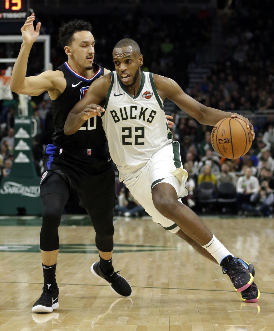 Milwaukee Bucks' Khris Middleton (22) drives to the basket against Los Angeles Clippers' Landry Shamet during the second half of an NBA basketball game Thursday, March 28, 2019, in Milwaukee. (AP Photo/Aaron Gash)