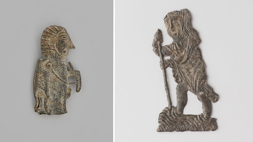 Two of the "plombs de la Seine," leaden artefacts found in the river, on display at "Dans La Seine".