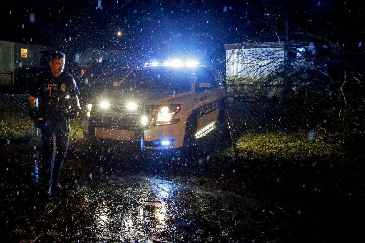 First responders survey a damaged mobile home after a possible tornado passed through Thursday, Feb. 17, 2022, in Leeds, Ala. (AP Photo/Butch Dill)