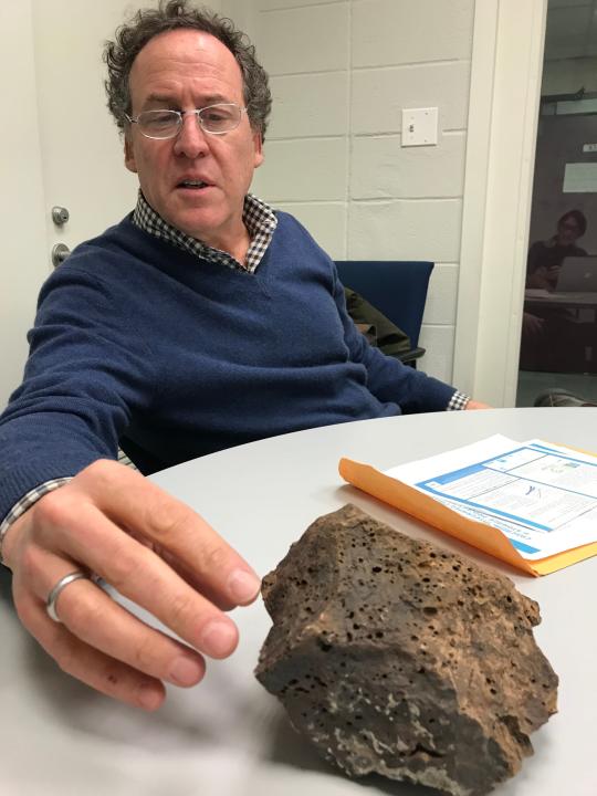 David Goldberg, a marine geology professor at Columbia’s Lamont-Doherty Earth Observatory in Palisades, New York, with a piece of porous basalt. He’s proposed a test that would pump 10,000 metric tons of carbon dioxide 1,000 to 2,000 feet down below the ocean floor off the Pacific Northwest coast. Iceland already has a similar pilot project up and running.