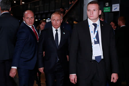 Russian President Vladimir Putin arrives to attend the opening session of the Paris Peace Forum as part of the commemoration ceremony for Armistice Day, 100 years after the end of the First World War, in Paris, France, November 11, 2018. REUTERS/Gonzalo Fuentes/Pool