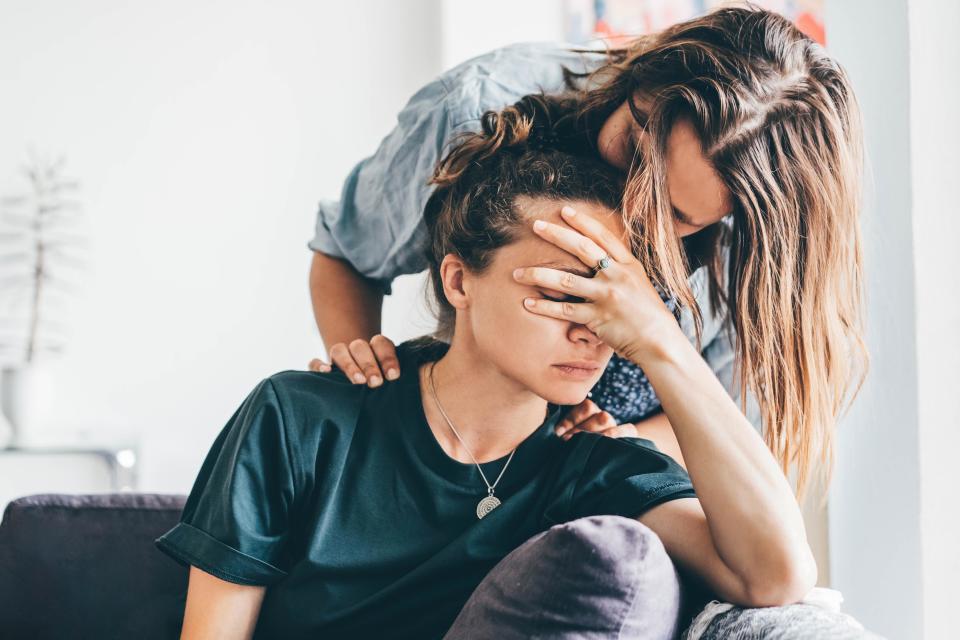 Jenny* comforted her friend Alison* after her marriage fell apart, but was soon being hounded by messages. Posed by models. (Getty Images)