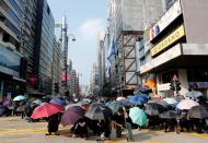 Anti-government demonstrators attend a protest march in Hong Kong