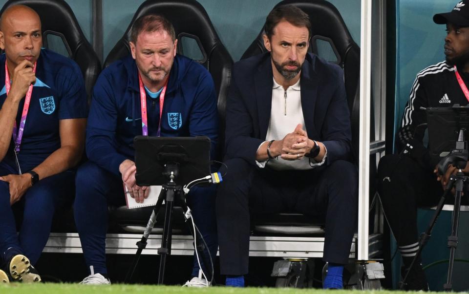 The England manager says he's happy to sit and watch the match while next to his assistant Steve Holland - POOL 