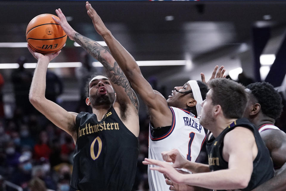 Northwestern guard Boo Buie, left, drives to the basket against Illinois guard Trent Frazier (1) during the second half of an NCAA college basketball game in Evanston, Ill., Saturday, Jan. 29, 2022. Illinois won 59-56. (AP Photo/Nam Y. Huh)