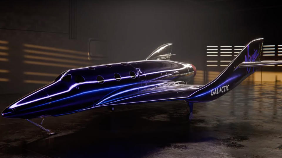  A metallic dark-purple space plane sits inside a hangar. 