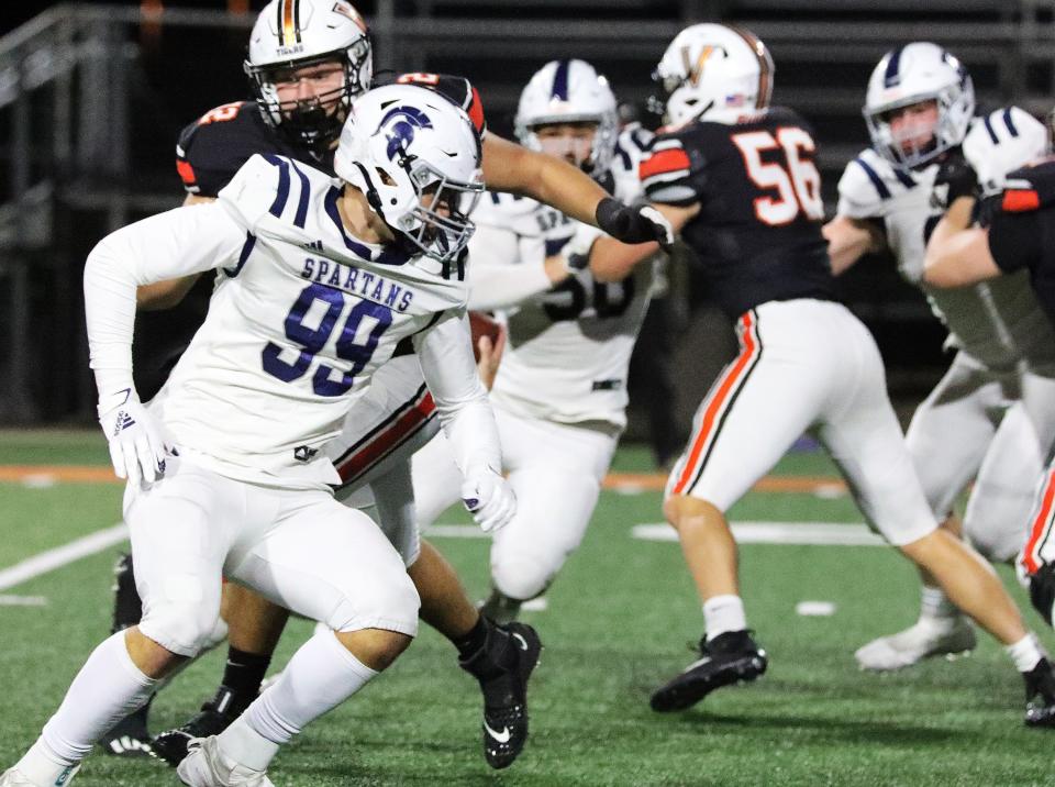 Pleasant Valley defensive end Andrew DePaepe (99) and the Spartans are now 4-0 this season and the new No. 1-ranked team in the Register's Class 5A rankings.