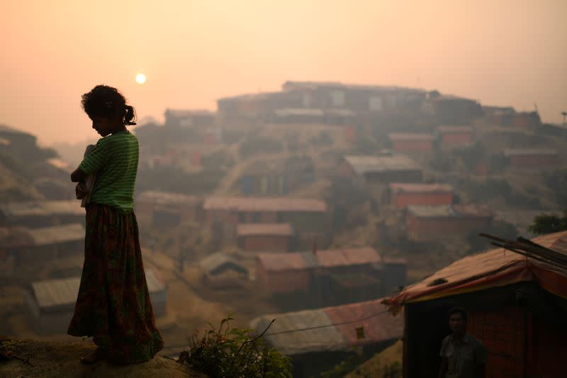 FILE PHOTO: The Wider Image: Rohingya refugees fish in troubled waters