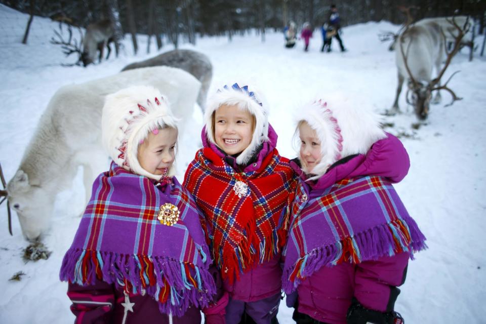 In this Thursday, Feb. 2, 2017 photo, Sami children, from left, Karen Seline Eira, Inga Helene Anti Persen and Leah Christine Utsi at the reindeer kindergarten in Karasjok, Norway. The indigenous people of Europe's Arctic region are celebrating the centenary of their national day this week with some 120 events planned in Norway. Monday’s start to weeklong festivities marks the centenary of the Sami people’s first congress in Trondheim, Norway, in 1917. Seventy-five years later, the Sami declared Feb. 6 their national day. ( Heiko Junge /NTB Scanpix via AP)