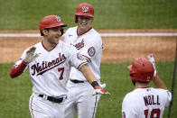 Washington Nationals' Trea Turner (7) celebrates his grand slam with Andrew Stevenson, center, and Jake Noll, right, during the third inning of a baseball game against the New York Mets, Sunday, Sept. 27, 2020, in Washington. (AP Photo/Nick Wass)